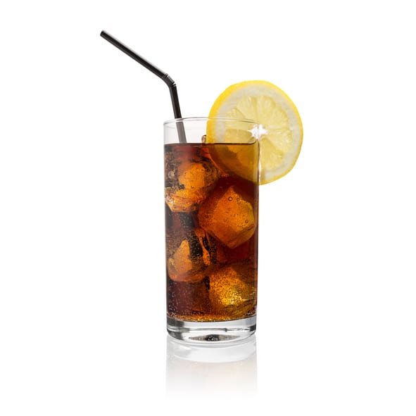 Close-Up Of Cola Drink In Glass With Drinking Straw And Lemon Slice